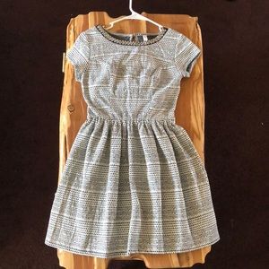 A black and white dress with tribal designs.